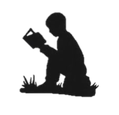 Silhouette of child reading a book